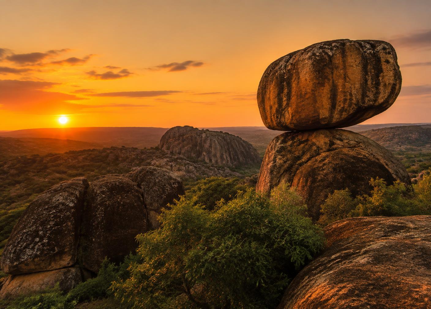 Granite balancing rock formations on a Zimbabwean hillside at sunset
